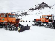 A mountain rescue effort using snow cats